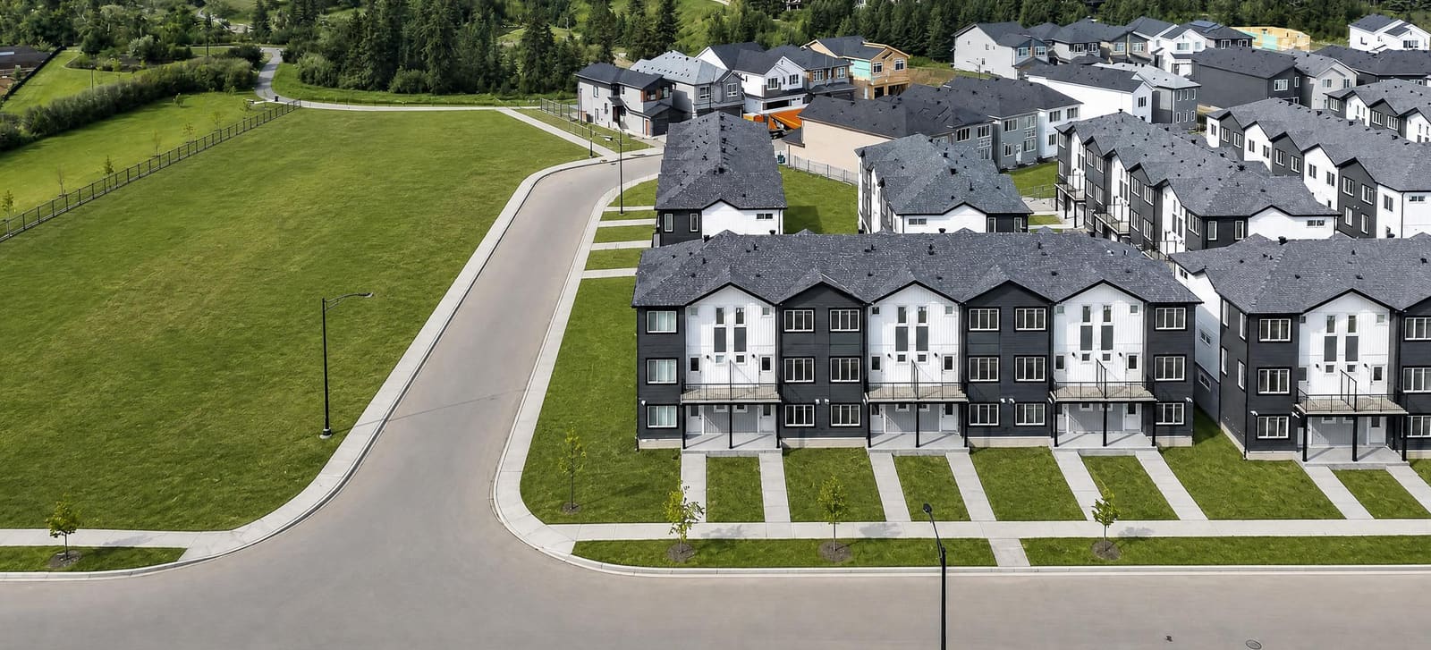 Aerial view of The Villas at Cavanagh Ravine rental community beside open green space in southwest Edmonton